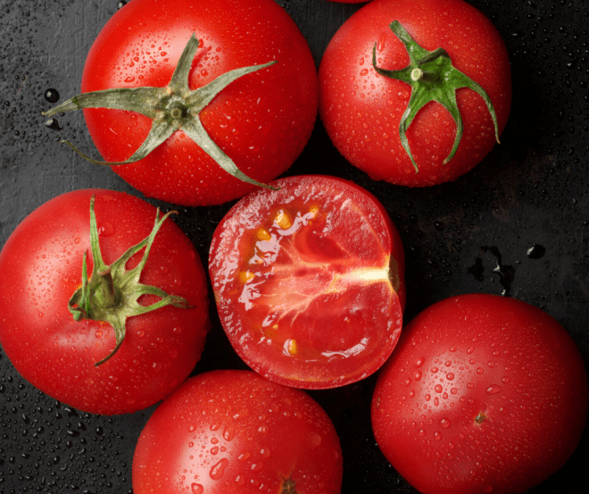 tomatoes on black background