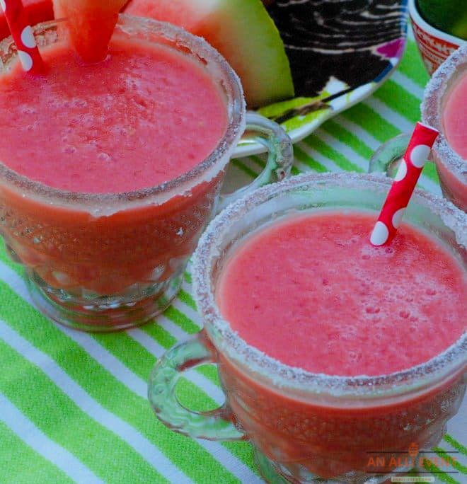 Watermelon Coolers in glasses with red straws
