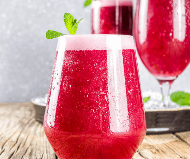 red jello punch garnished with mint leaves - favorite punch recipes