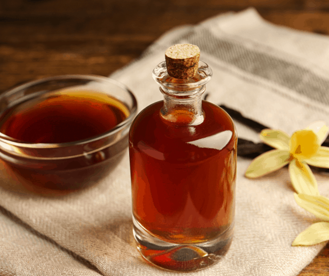 Homemade Vanilla Extract in glass bottle with cork 