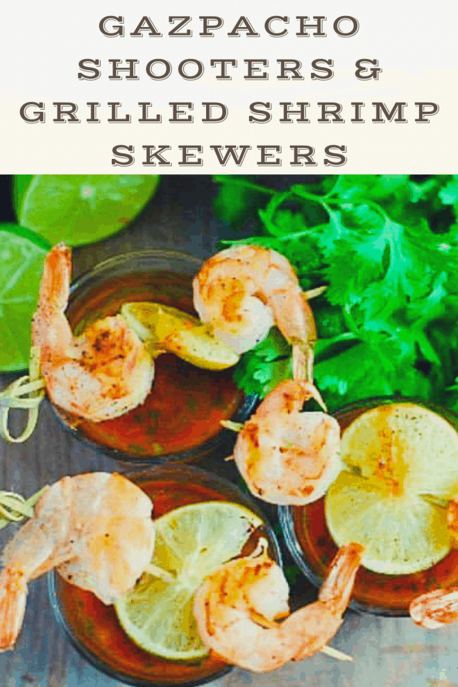 Chilled Gazpacho served in shot glasses and topped with grilled shrimp and lime skewers