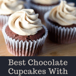 Chocolate Cupcakes With Peanut Butter Frosting on a wooden cutting board