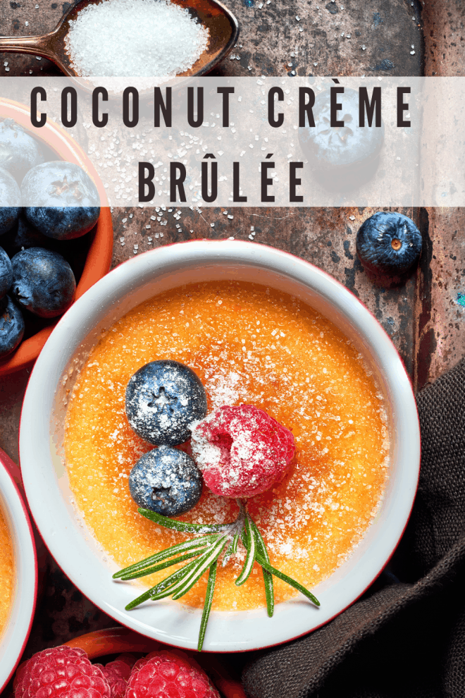 Coconut Crème Brûlée in ramekin topped with berries