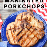 Grilled Marinated pork chops on a blue platter with red, white and blue decor around the plate