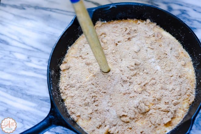 Poke holes in the Carolina Skillet Cake so the topping can mingle with the cake.