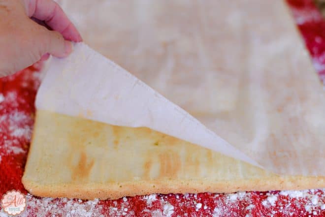 Remove parchment paper from the Coconut Cake Roll