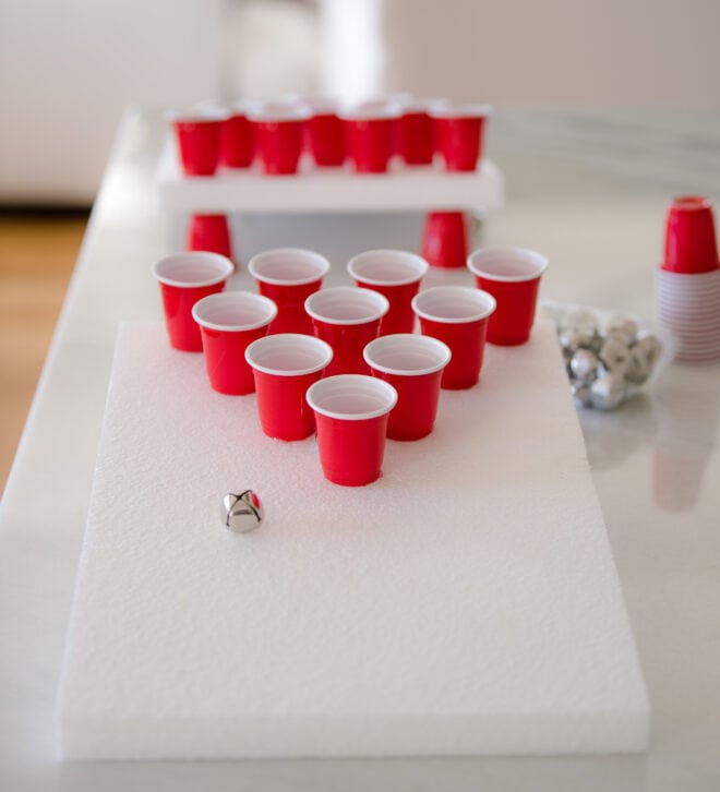 jingle bell toss game - two foam boards with mini red solo cups