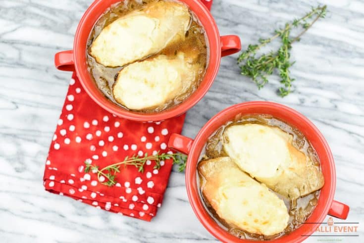Bowls of French Onion Soup topped with baguette and cheese