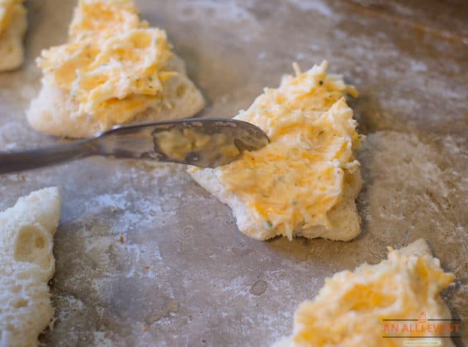 Spread cheese mixture on bread - Cheesy Christmas Tree Shaped Appetizers