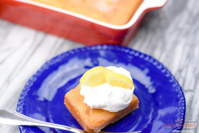 Lemonade Poke Cake Topped with Whipped Cream