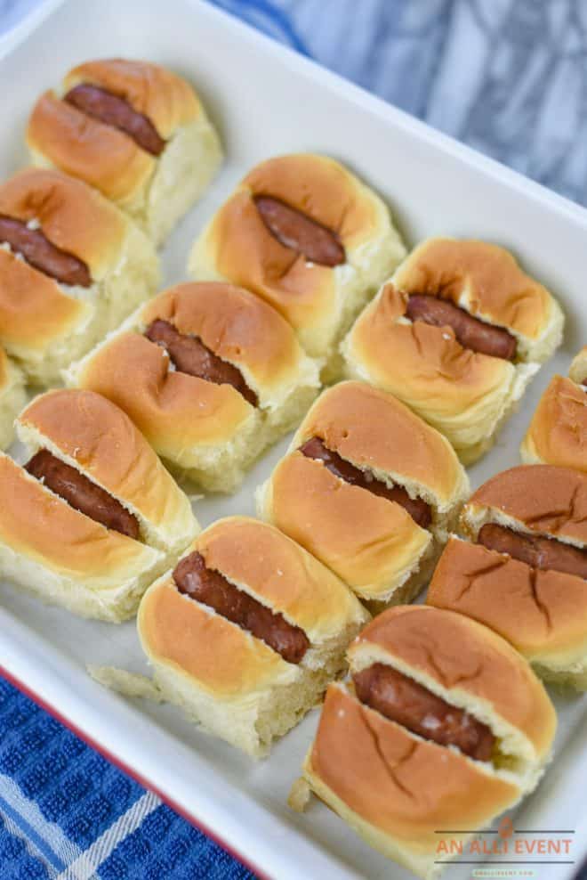 Add franks to the rolls to make mini chili cheese dogs.