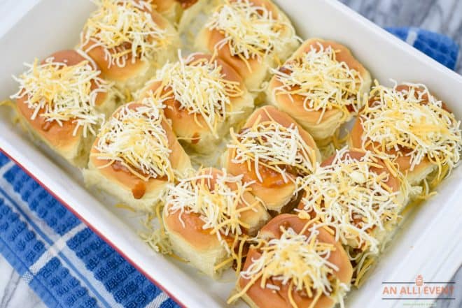 Add shredded cheese to make Mini Chili Cheese Dogs