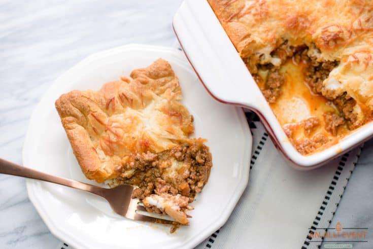 Ground Beef and Pasta Sauce Served with a Crescent Roll Crust and Parmesan Cheese