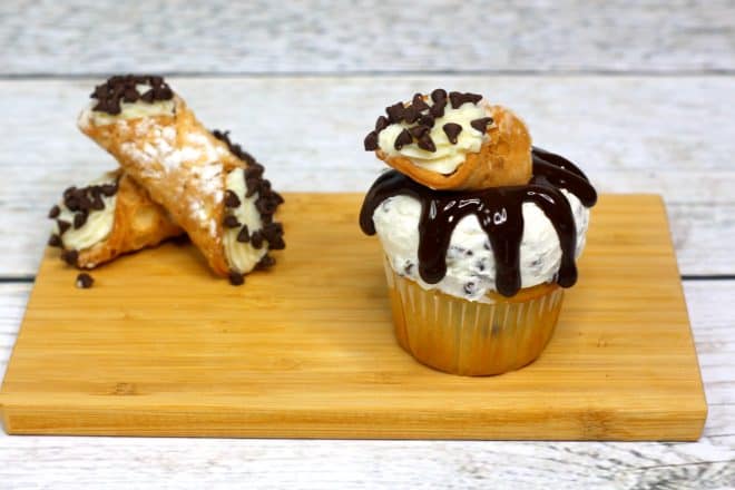 Cannoli Topped Cupcakes on cutting board
