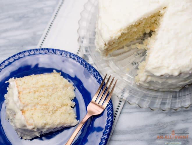 One Slice of Coconut Cake and a whole coconut cake side by side