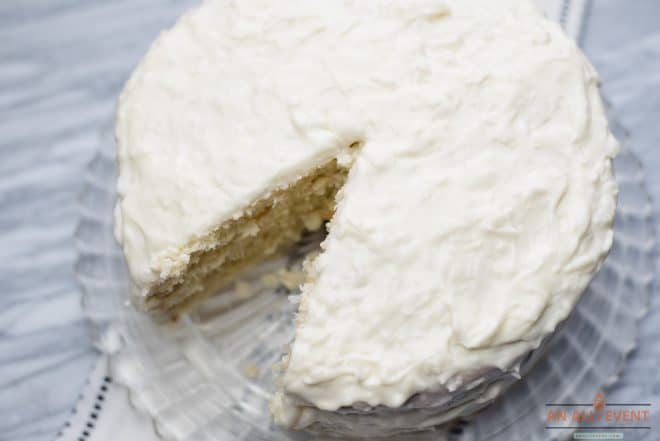 Best Coconut Cake With Frosting on a glass cake plate