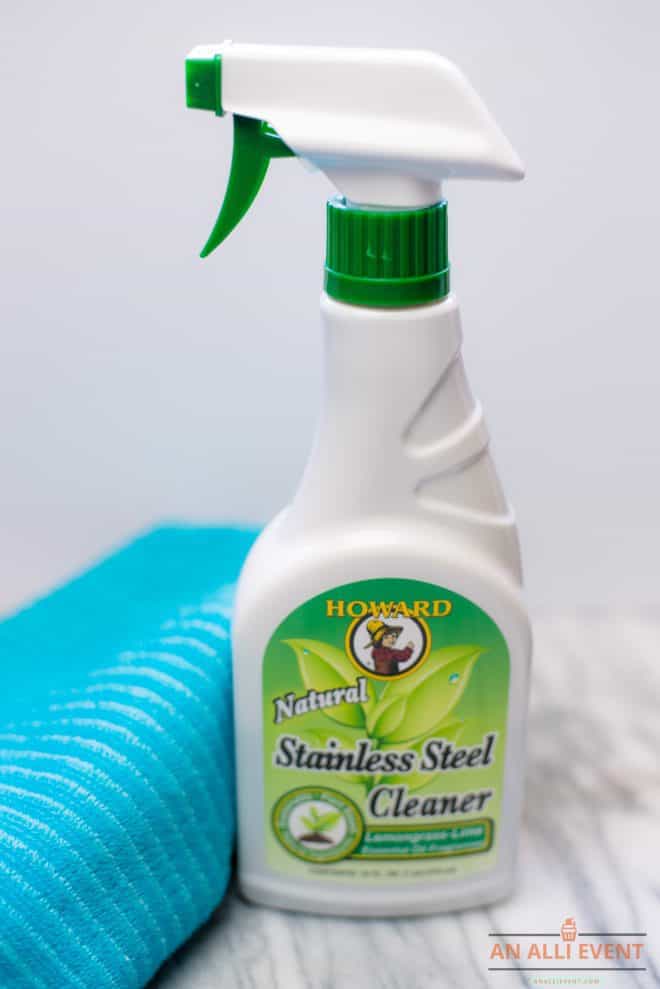 Best Ever Stainless Steal Cleaner - White Spray Bottle With Green label besides a blue cleaning cloth