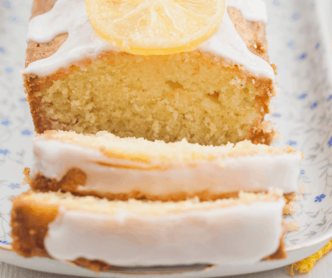 Lemon Bread with Lemon Glaze sliced on a serving tray