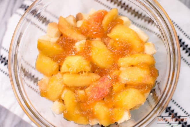 Fresh Sliced Peaches brushed with peach preserves in a glass bowl