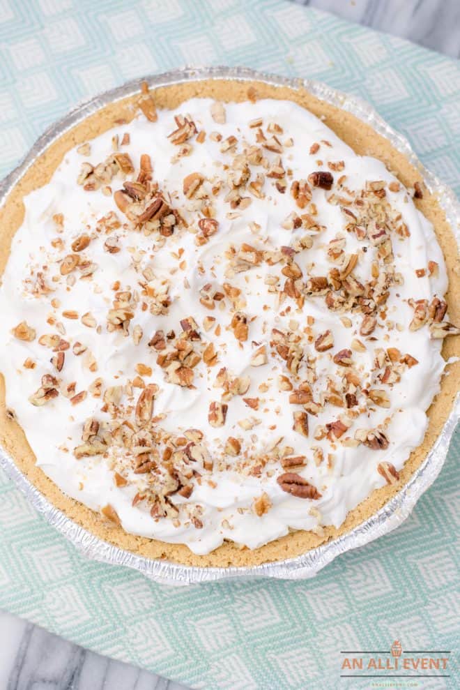 Banana Split Pie Topped With Whipped Topping and Nuts