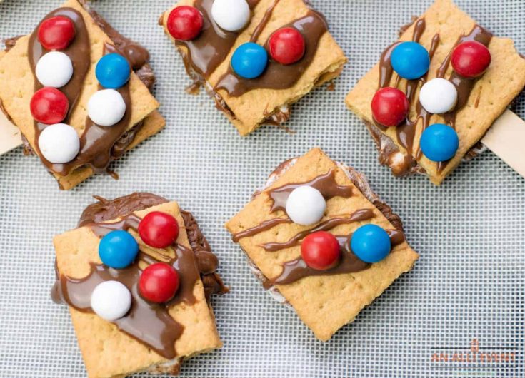 Patriotic S'Mores On A Stick on a baking pan