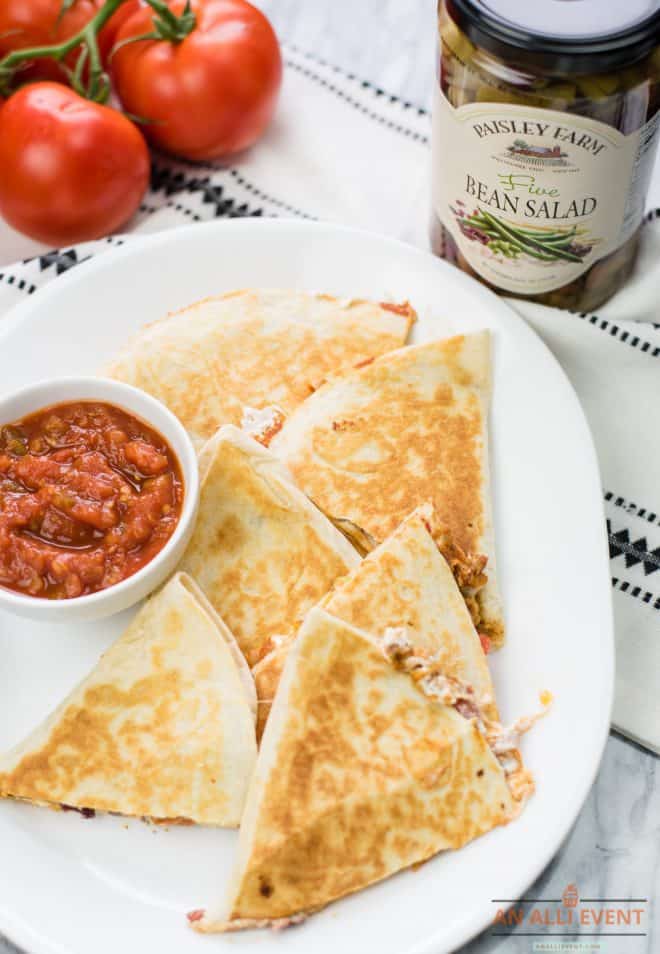 Taco Dip Quesadillas on a white plate served with tomato salsa