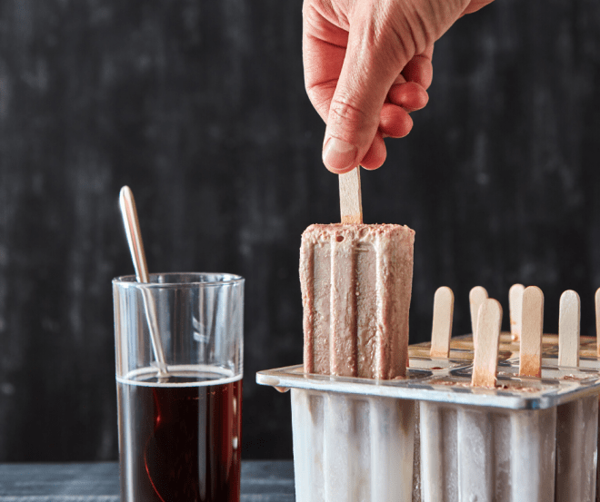 coffee infused desserts including coffee popsicles being pulled out of the mold