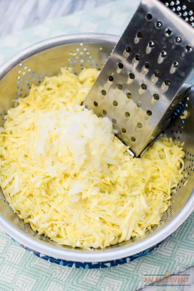 Grated yellow squash and onions in a colander to drain