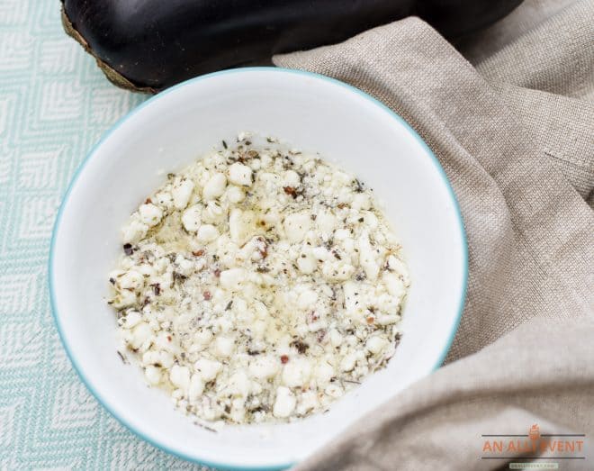 White bowl filled with marinated feta cheese