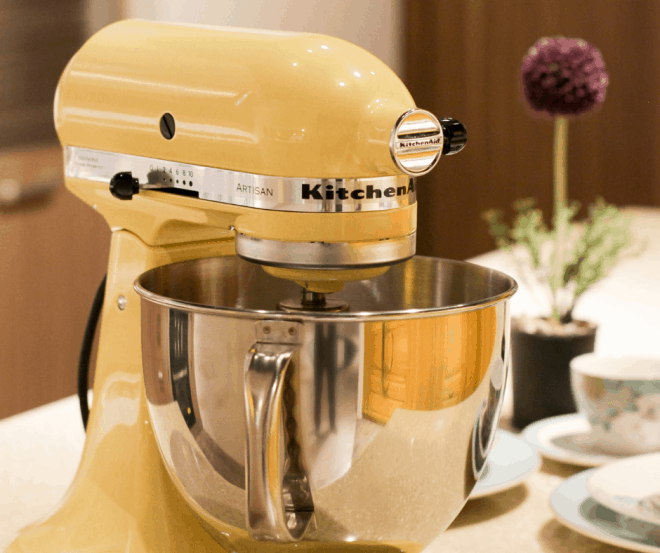 Yellow KitchenAid Stand Mixer with silver bowl on counter