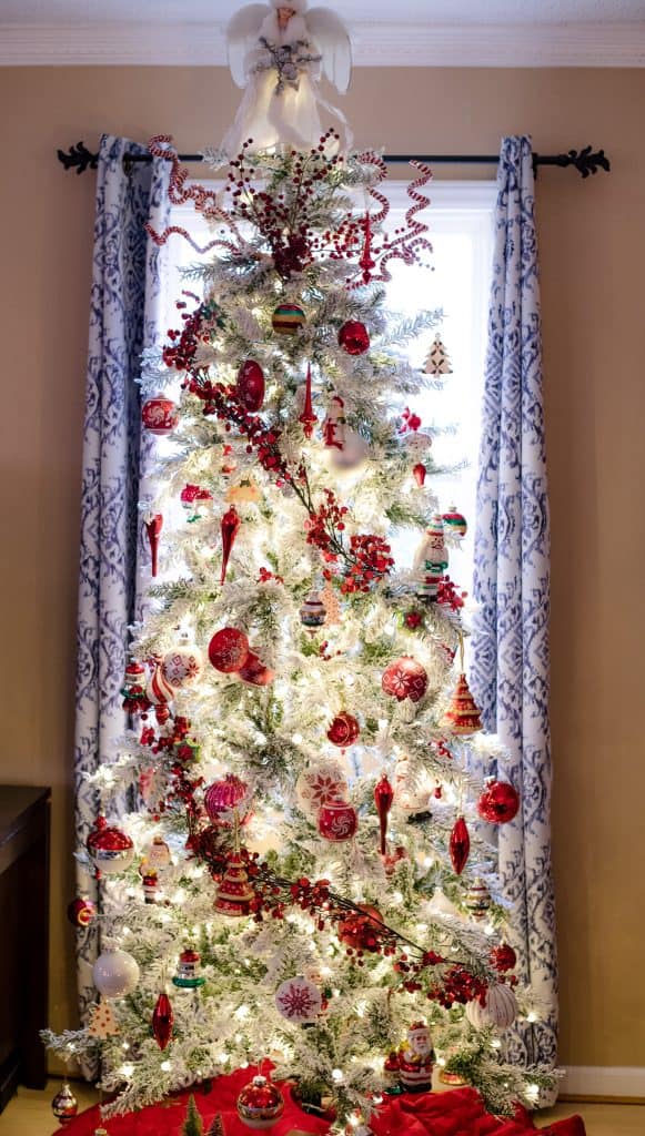 Flocked Christmas Tree With Red and White Ornaments