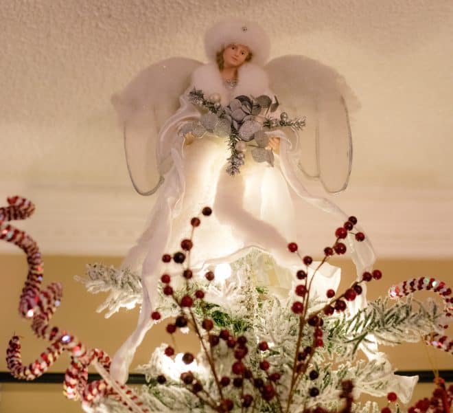 White Snow Angel on Top Of Flocked Christmas Tree