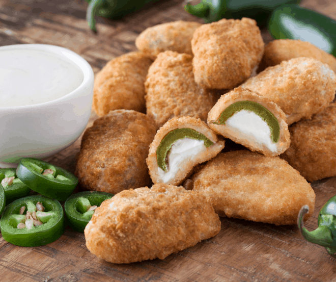 Air Fryer Jalapeño Bites on brown serving board with a white bowl of ranch dressing