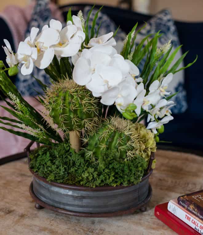 Faux plants in a bronze rustic shallow planter