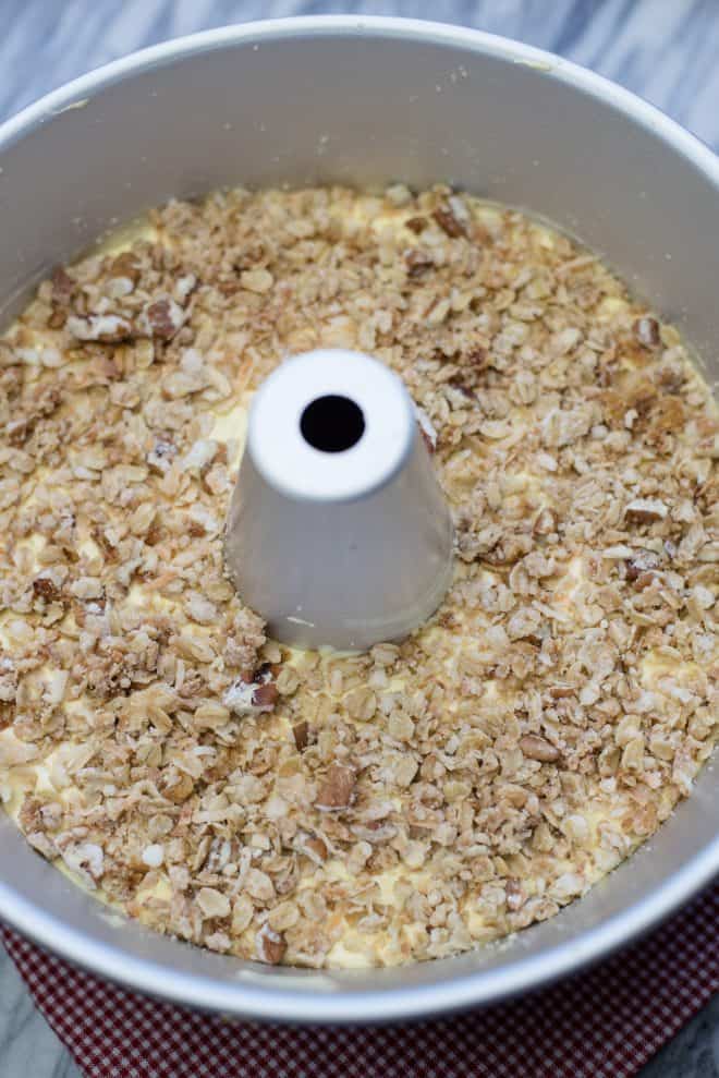 Banana Cake layered with granola and ready to bake in a tube pan