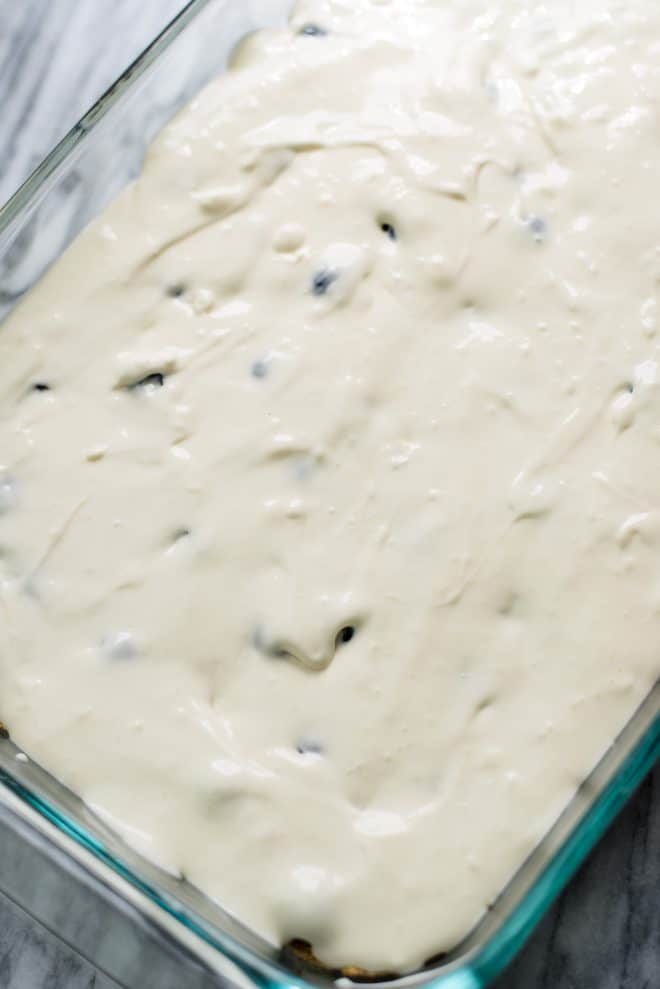 Cream Cheese Mixture tops blueberry cheesecake bars before baking