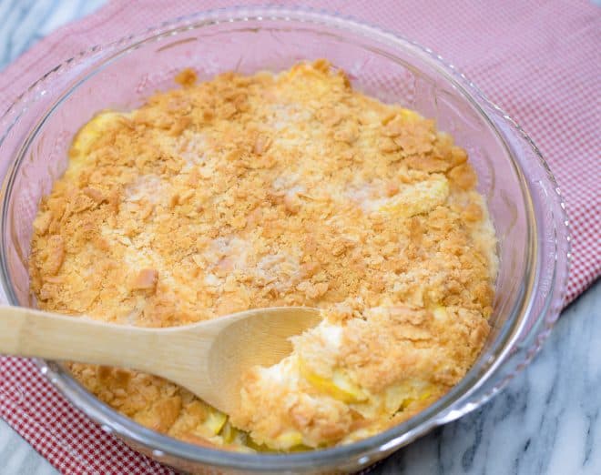 Baked Squash Casserole in a glass dish