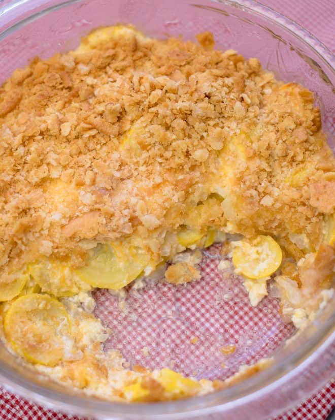 Squash Casserole with a couple of scoops of casserole removed from the dish