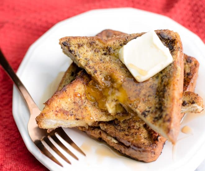 French toast stuffed with cream cheese and peach preserves cut in a triangle 