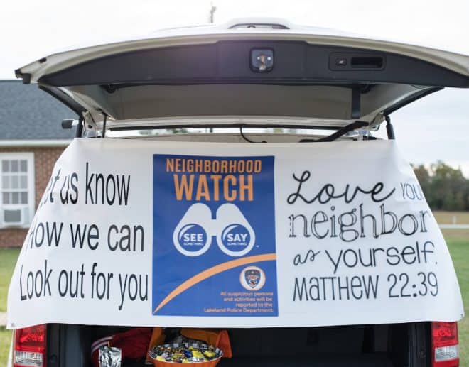 Neighborhood Watch Trunk - Love Your Neighbor As Yourself sign in trunk