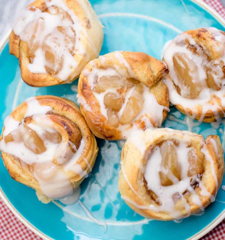 Cinnamon Roll Apple Pies on a blue serving platter