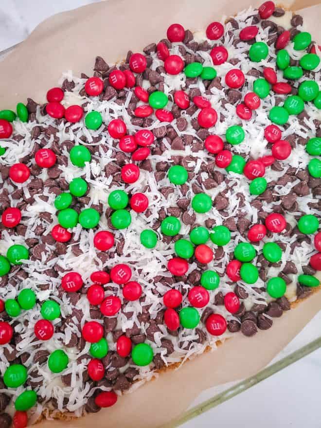 M&Ms layer of holiday magic cookie bars