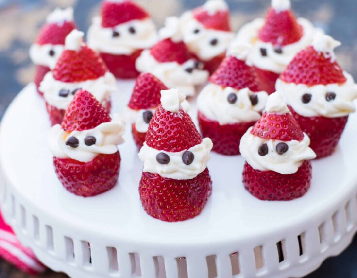 White Tray Filled With Strawberry Santa Clauses