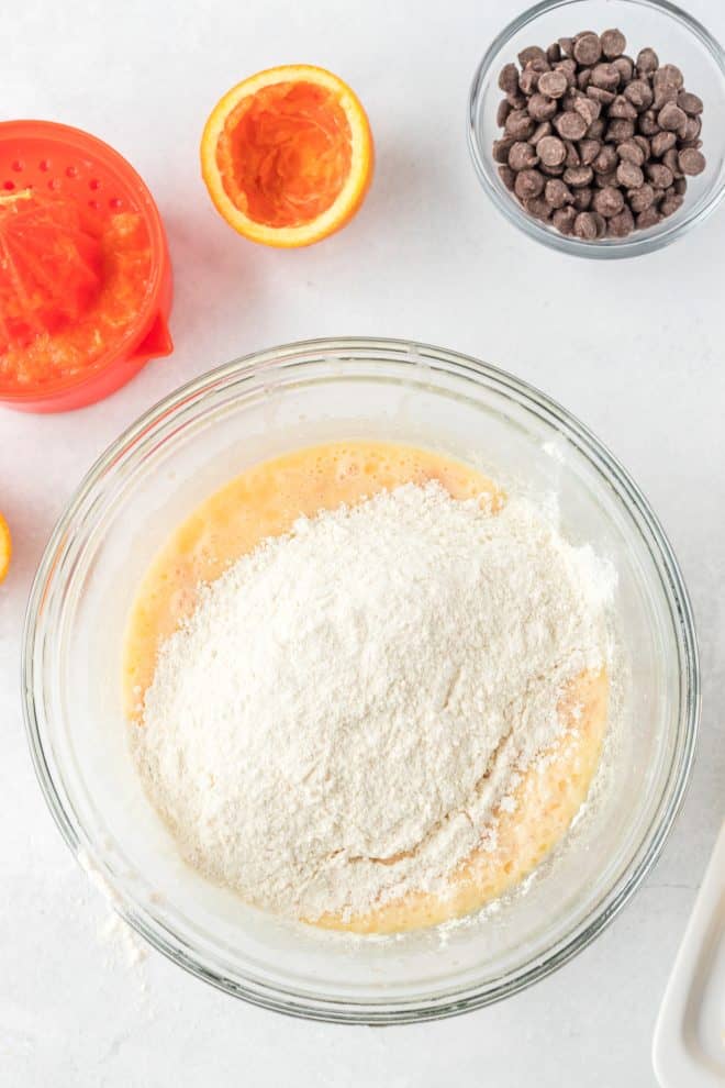 sift dry and wet ingredients together to make orange muffins