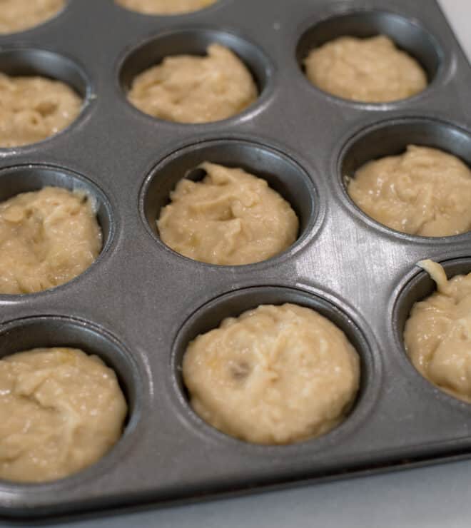 banana muffins batter in cupcake tin before baking