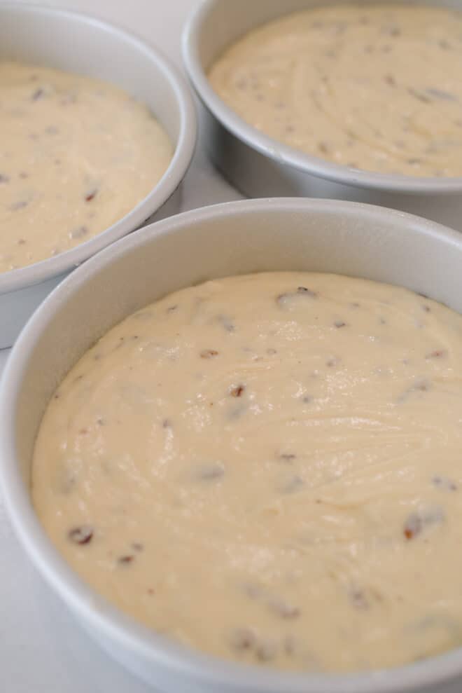 Toasted Butter Pecan Cake Batter in three 9-inch cake pans