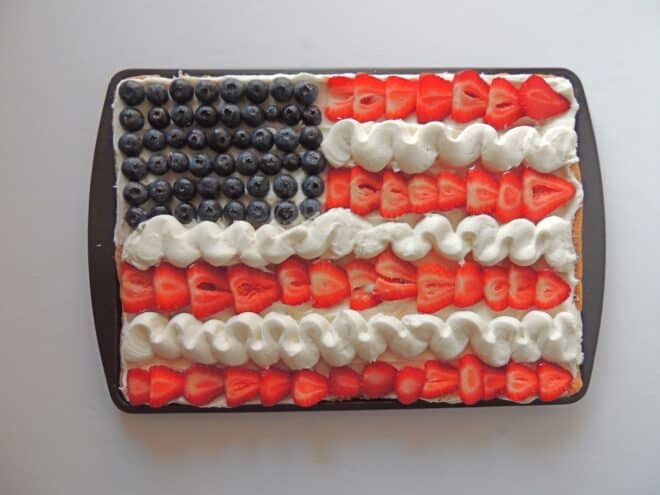 Close-up of American Flag Cake decorated with blueberries and strawberries to look like the flag