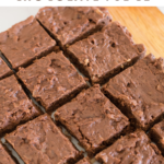 German Chocolate Fudge cut into squares on cutting board