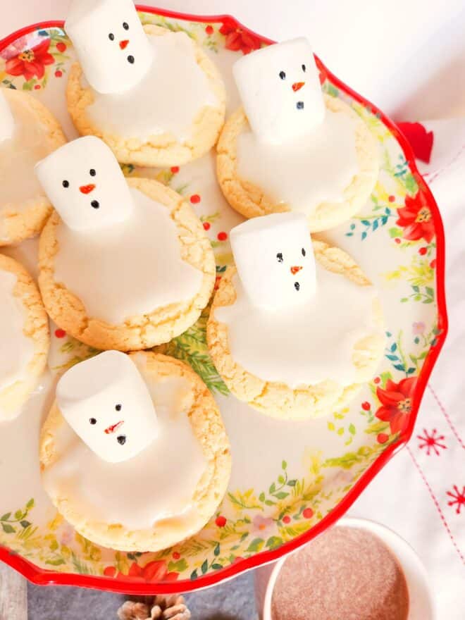 Melting Snowman Sugar Cookies on a pretty Christmas platter
