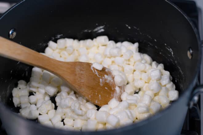 marshmallows and butter melting in a large saucepan on cook top